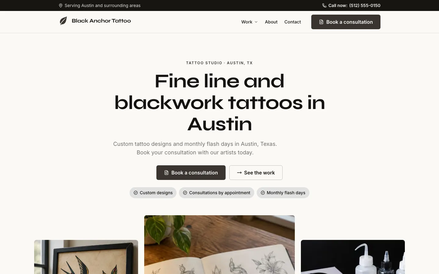 The Black Anchor Tattoo website on a computer